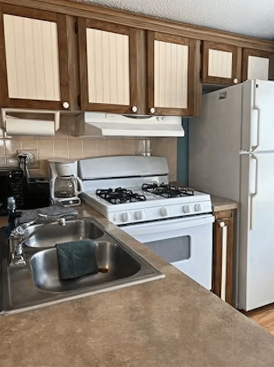 Kitchen with stove and fridge
