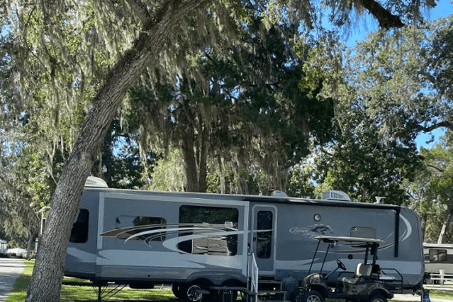 Travel trailer in shaded campsite