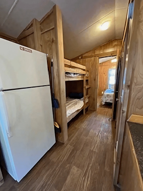 Wooden cabin interior with bunk beds
