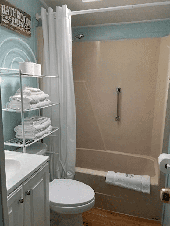 Small bathroom featuring a shower curtain