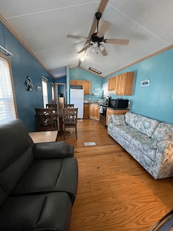 Open-plan living space with ceiling fan