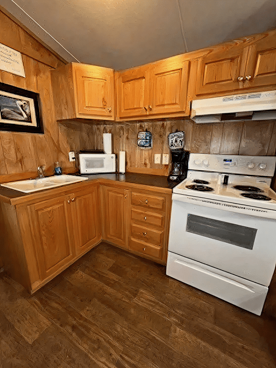 Compact wooden kitchen with appliances