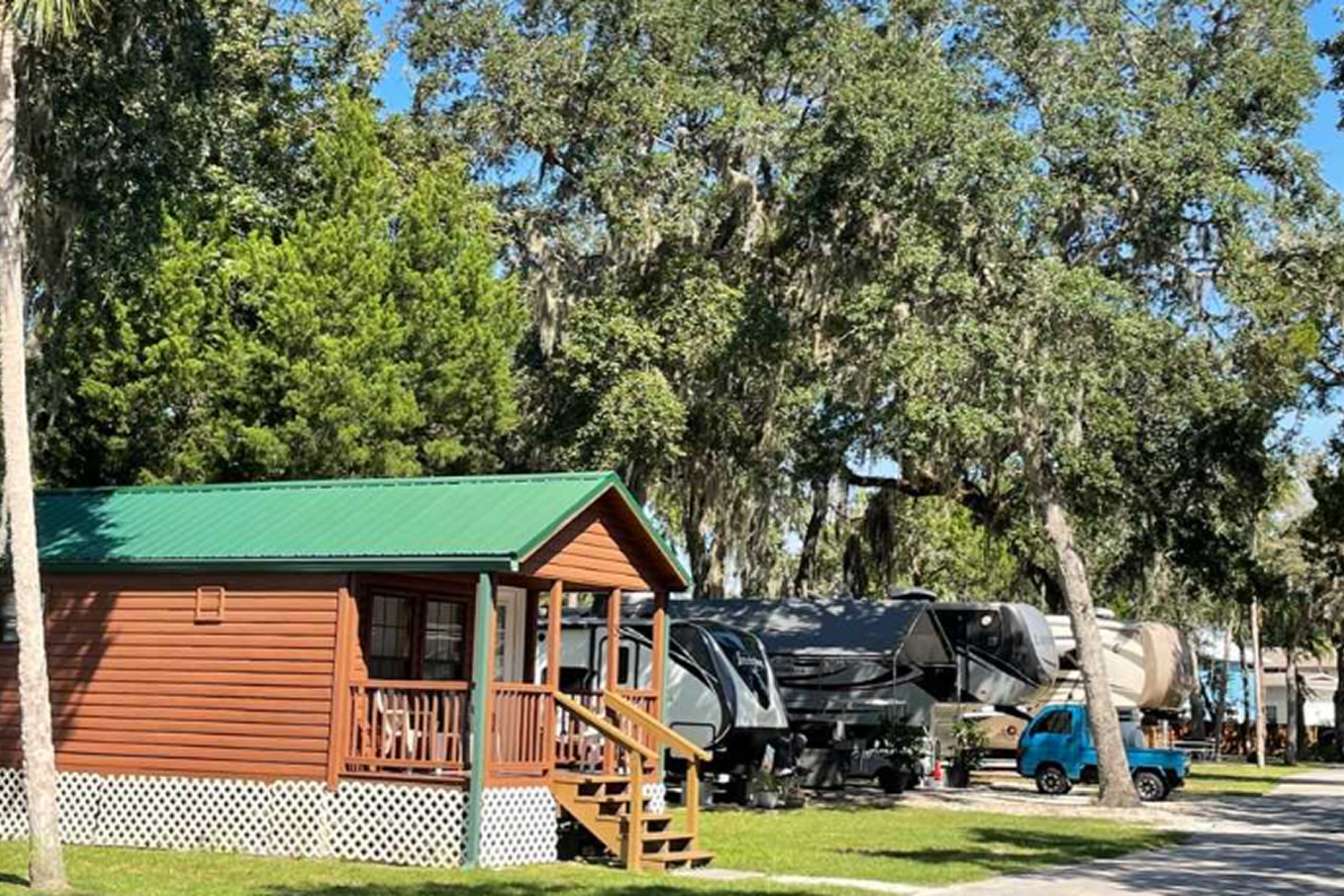 Cozy cabin beside parked RVs