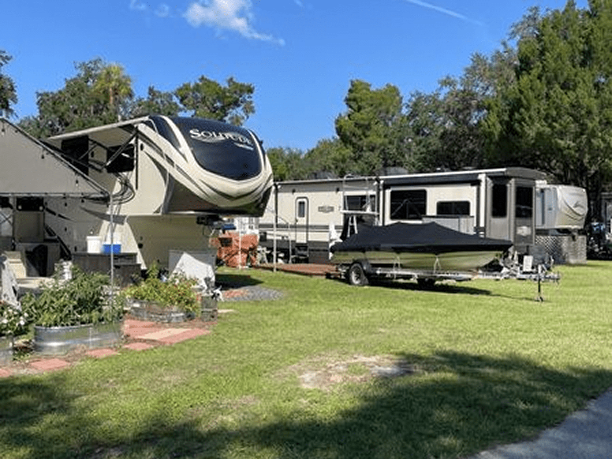 Recreational vehicles and boat in campsite