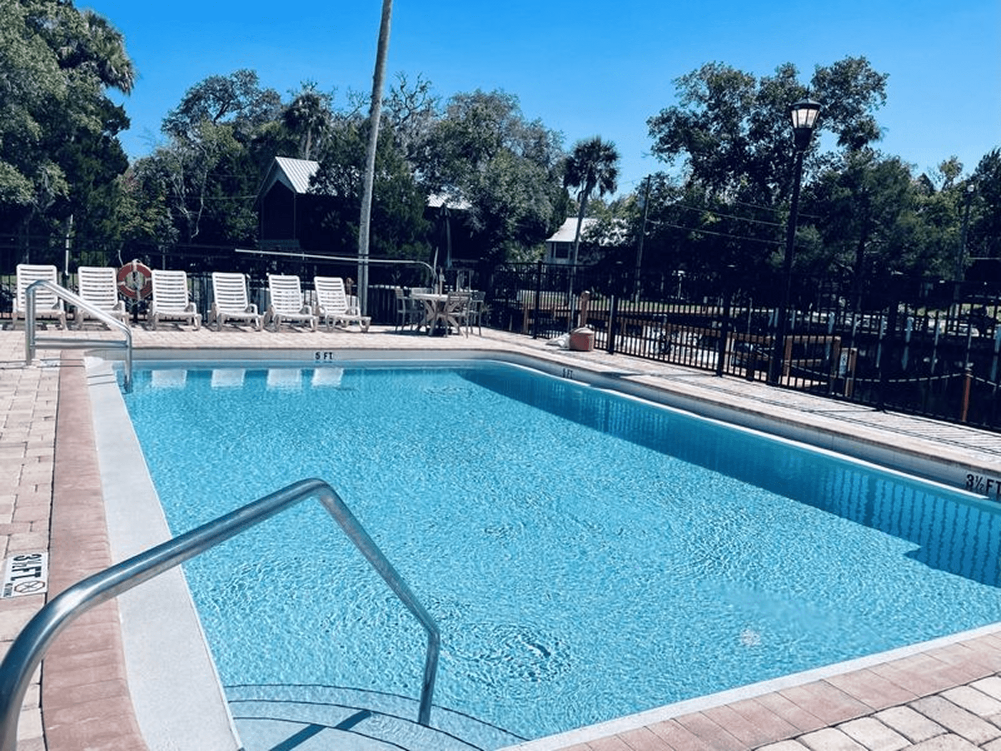 Outdoor swimming pool with lounge chairs
