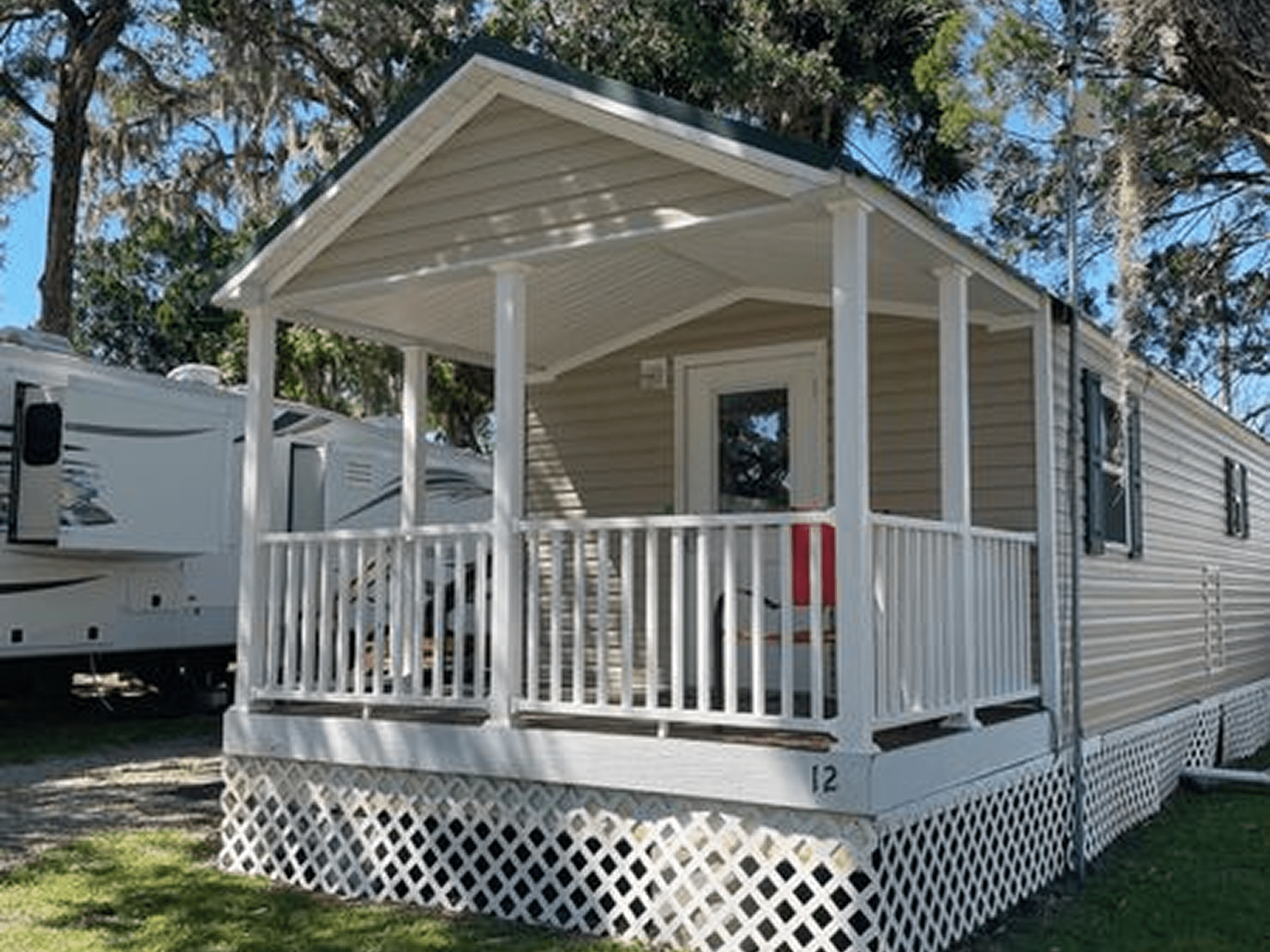 Mobile home with white porch railing